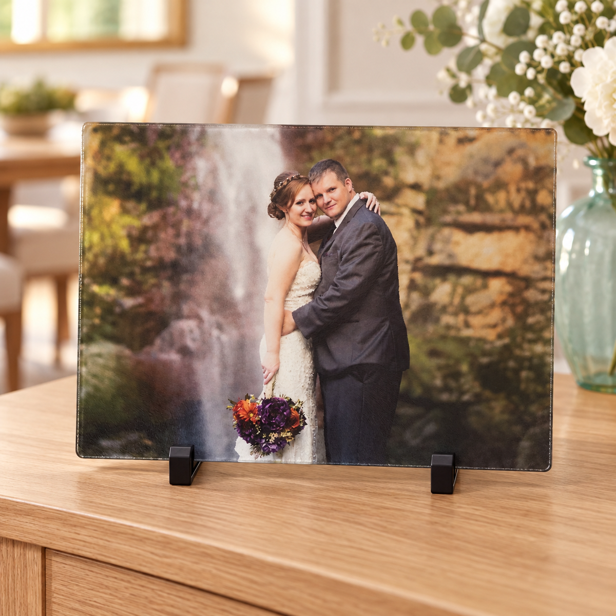 Wedding photo cutting board and included stand in a styled dining room